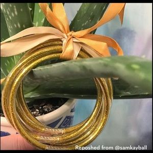 All weather GOLD silicone bangles; these have a gold glitter look; 5 in the set